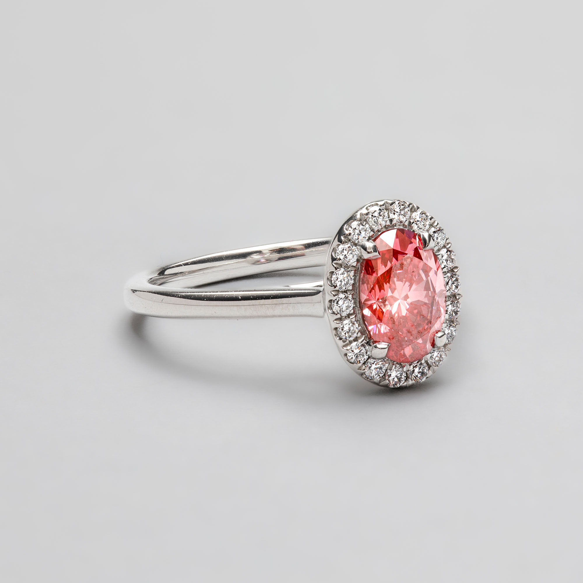 Platinum Oval Shape Pink Diamond with Halo Ring