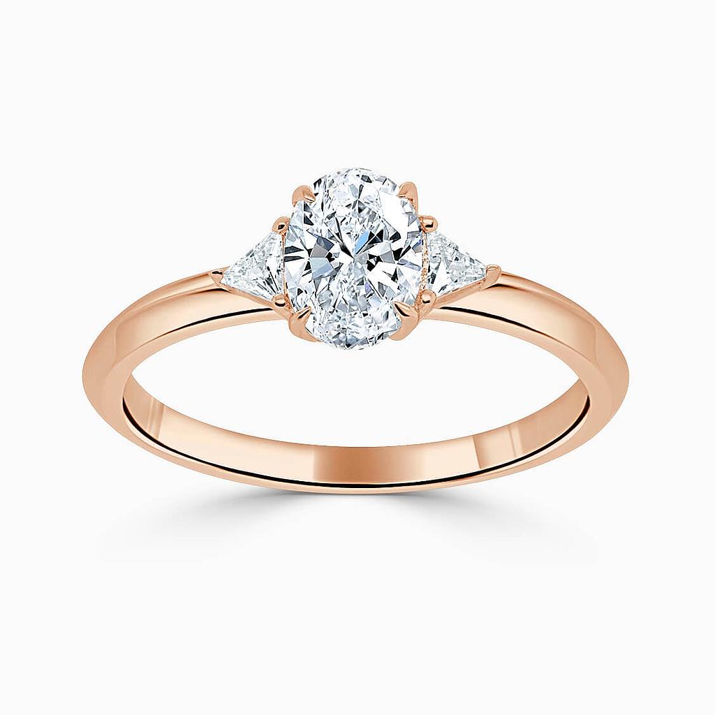 18ct Rose Gold Oval Shape 3 Stone With Trillions Engagement Ring