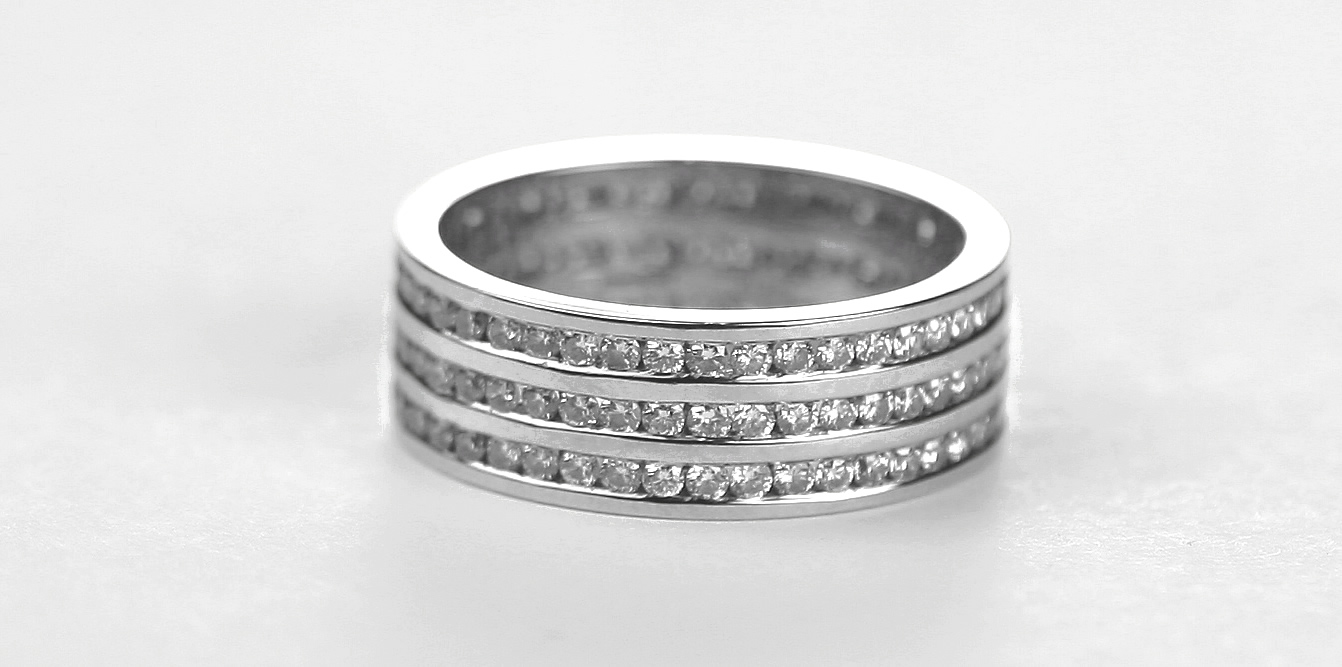 a three row round brilliant diamond wedding ring
