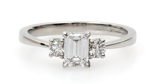 emerald cut diamond three stone engagement ring