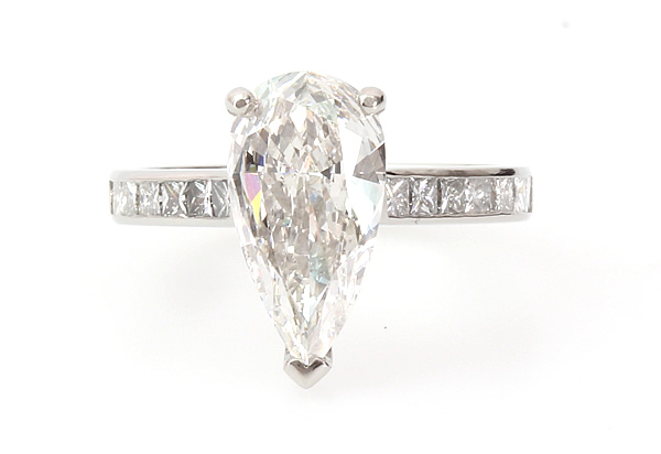 pear shaped diamond engagement ring with diamond set shoulders