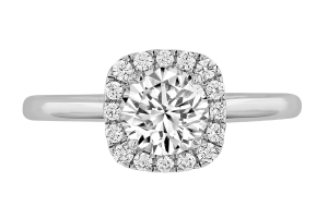 A halo engagement ring with a round brilliant diamond centre stone, set in white gold
